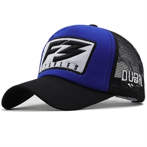 Detailed close-up of F3 Stables 3D embroidery on blue and black trucker hat