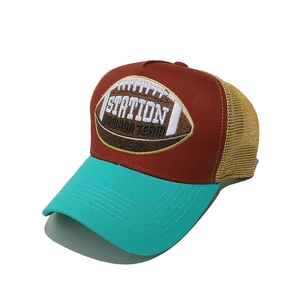 Detail of rugby embroidery on tri-color mesh trucker hat with wine red and teal panels