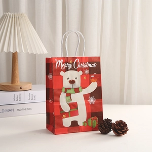 Christmas paper gift bag featuring a polar bear print and red checkered holiday design