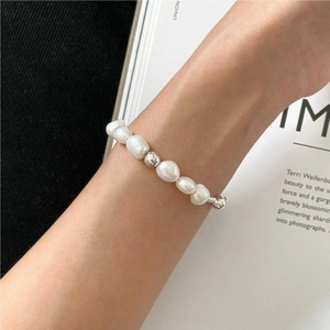 Elegant S925 sterling silver pearl bracelet with geometric metal beads on wrist