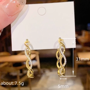 Elegant gold twisted hoop earrings featuring white zircon inlay and 31mm length