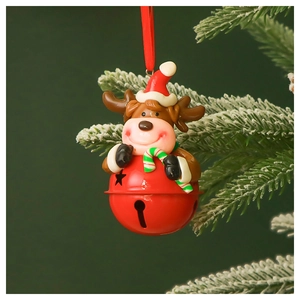 Close-up of a red metal Christmas bell featuring a 3D reindeer holding a candy cane