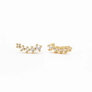 Detailed view of curved S925 silver gold-plated stud earrings with rows of sparkling zircon