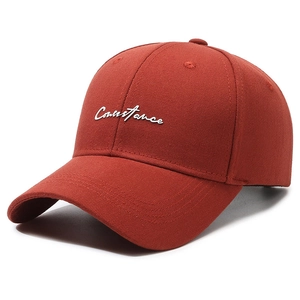 Rust red cotton baseball cap featuring white Constance embroidery in 45-degree view