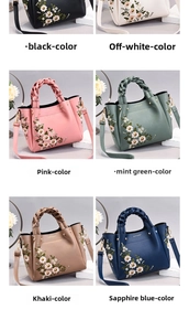 Detail view of floral embroidery patterns and woven handles on elegant tote bags