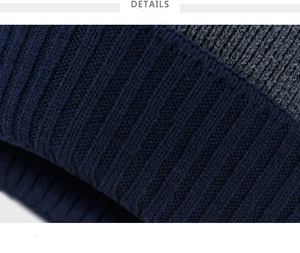 Close-up of thick ribbed knit texture in navy blue and grey colors for winter hat