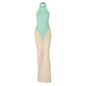 Detail of mint green halter neck bodice and beige pleated long skirt for women