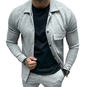 Detail showing high-quality twill fabric texture and black buttons on a slim grey jacket