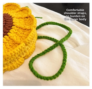 Detail of sunflower crochet bag showing comfortable green woven shoulder strap stitching