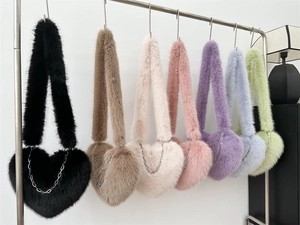 Plush heart-shaped crossbody bags in seven macaron colors with elegant silver chain details