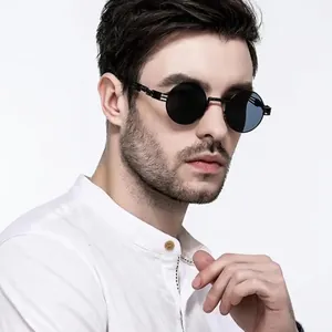 Steampunk round sunglasses with black metal frame and intricate hollowed-out temples