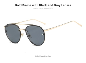 Close-up of gold metal aviator sunglasses with gray lenses and double bridge detail