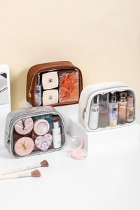 Detail of luxury PU and PVC toiletry bags showing spacious storage on display stands