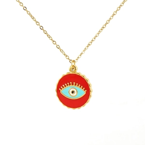 Golden stainless steel necklace with a red enamel round evil eye pendant on white backdrop