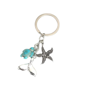 Sea turtle and starfish keychain with silver whale tail charm for ocean lovers