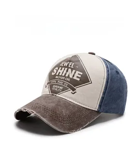 Detail of vintage washed baseball cap with distressed brim and retro oil-themed shield patch