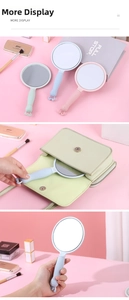 Detailed views of portable handheld makeup mirrors in pastel colors with cartoon handles