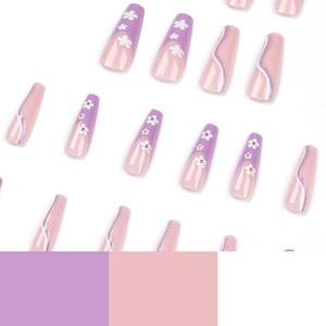 Long coffin fake nails with purple floral patterns and silver glitter wavy lines