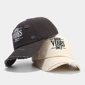 Distressed cotton baseball caps with Good Vibes Only embroidery in grey and beige