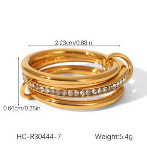 Detailed view of triple-layered gold stainless steel ring with micro-paved zircon stones