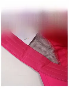 Detail of moisture-wicking sweatband and breathable mesh lining in rose red sports cap