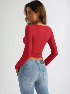 Detailed back view of a red slim-fit U-neck long sleeve top with elastic ribbed fabric