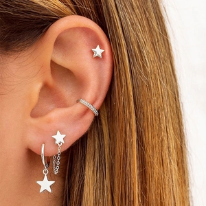 Minimalist silver star earring set including studs, chain drops and textured ear cuffs