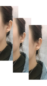 Three sizes of simple gold hoop earrings shown on model for size comparison