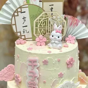 Chinese style rabbit cake topper set with peach blossoms and traditional fan decor
