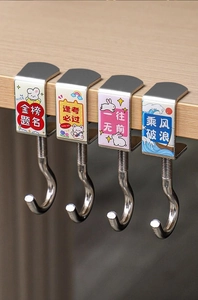 Macro detail of four adjustable metal desk hooks with motivational prints for school bags
