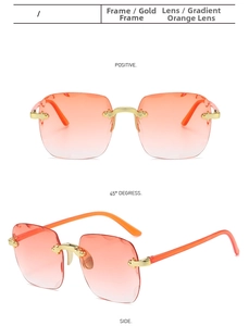 Detail view of rimless square sunglasses with gradient orange lenses and gold wavy edges