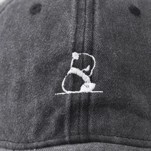 Washed black cotton baseball cap with detailed white panda embroidery on the front