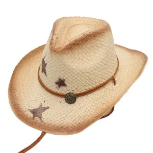 Detail of hand-woven cowboy straw hat showing vintage burnt edges and star patterns