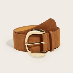 Detailed texture of brown suede wide belt with elegant gold-tone circular metal buckle