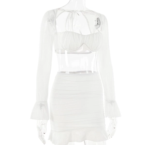 Detailed view of white two-piece set featuring sheer long sleeves and ruffled hem skirt