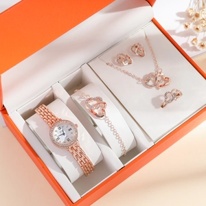 Detailed view of 5-piece rose gold jewelry set with crystal accents in a luxury gift box