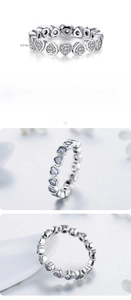 Detail view of 925 sterling silver eternity ring featuring heart-cut cubic zirconia stones