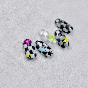 Japanese style black and white checkerboard nail stickers with colorful star patterns