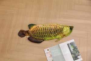 Macro view of realistic golden dragon fish plush cover on a stylish wooden floor