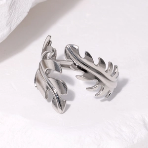 Minimalist silver stainless steel open ring featuring a monstera leaf design on stone