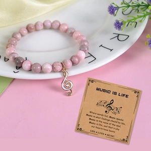 Bracelet musique en pierre zébrée rose avec perles 8mm et breloque note de musique