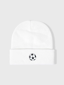 Close-up of white ribbed knit beanie featuring detailed black and white football embroidery