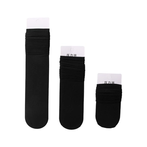 Three pairs of black compression slimming socks in long, medium, and short styles