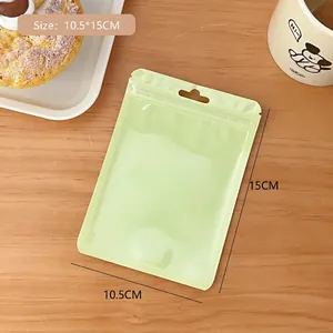 Close-up of a light green semi-transparent frosted resealable bag with hanging hole and zipper