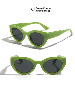 Detailed view of cat eye sunglasses with vibrant green frames and dark grey lenses