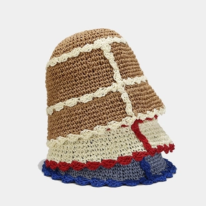 Three stacked handmade crochet bucket hats with contrast wavy edges in neutral tones