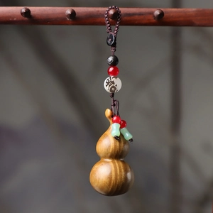 Handcrafted rosewood gourd keychain with colorful beads and hand-woven cord
