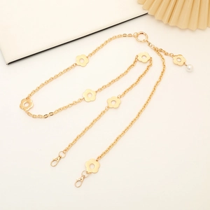 Elegant gold metal crossbody chain strap with hollow flower charms and pearl detail
