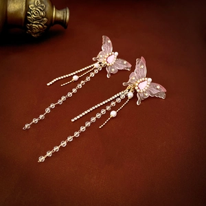 Sparkly butterfly drop earrings with long tassels, pink crystal wings and dangling pearls