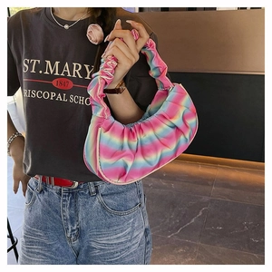 Detailed close-up of rainbow pleated shoulder bag with unique cloud texture and satin finish
